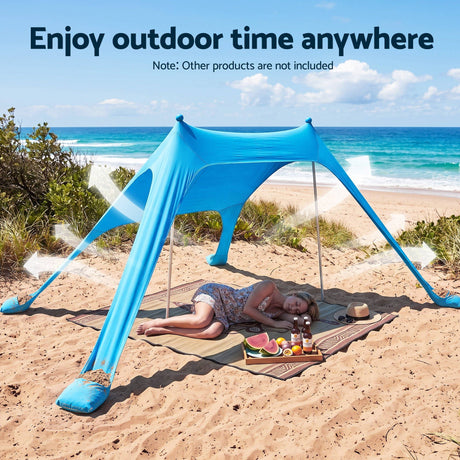 Blue portable beach tent, supplied with a carry bag.