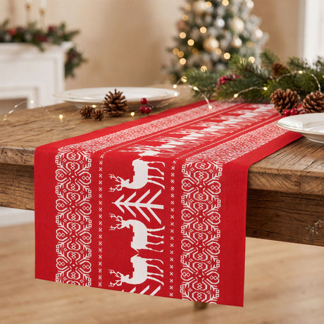Red Christmas table runner 270 by 28cm with a reindeer pattern.