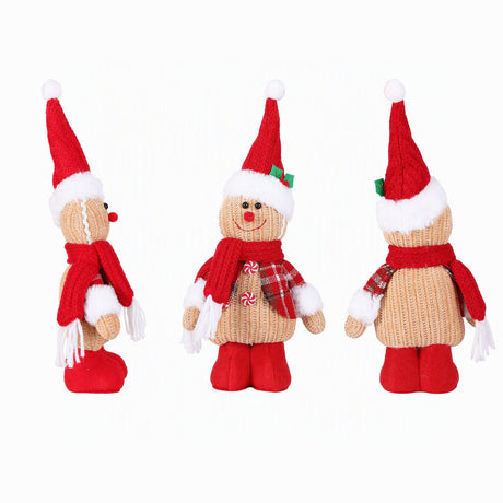 Standing knitted gingerbread man ornament for indoor display.
