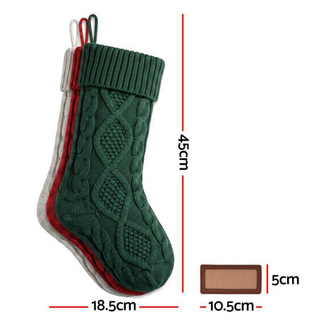 Another view of the three knitted stockings.