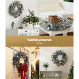 The 60cm snowy LED wreath shown again, arriving pre-lit.