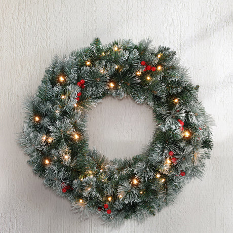 The 60cm snowy lit wreath shown again, arriving pre-lit.