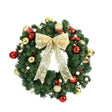 Pre-lit Christmas wreath 60cm across with berries, a bow and baubles.