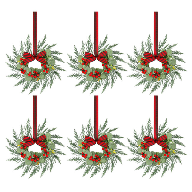 Six small pre-lit Christmas wreaths 26cm across with red berries and bows.