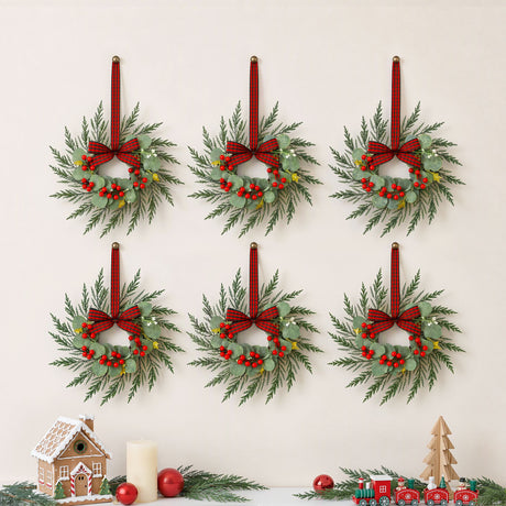 Six 26cm pre-lit wreaths, arriving pre-lit.