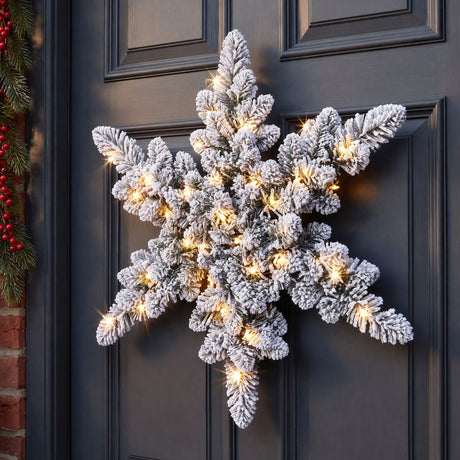 The 60cm flocked wreath shown again, arriving pre-lit.