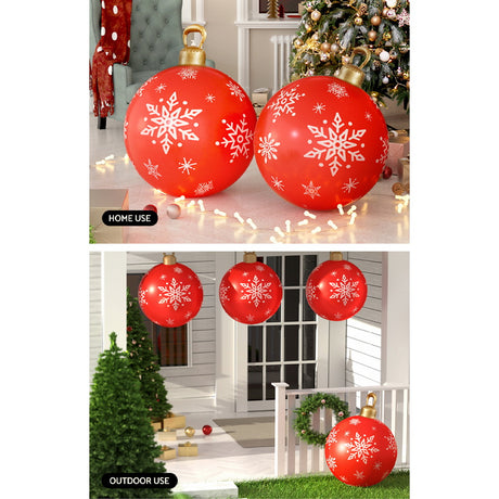 The red inflatable bauble shown again, deflates flat for storage.