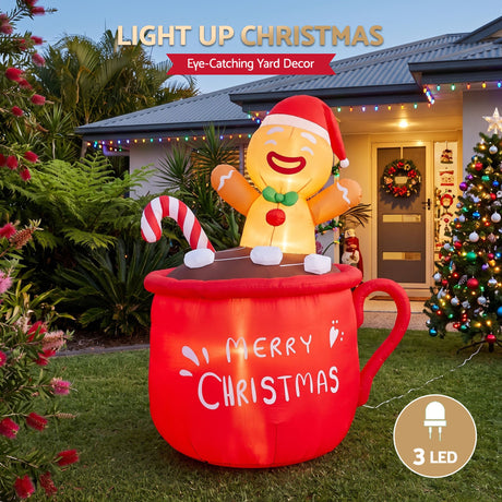 Another view of the inflatable Christmas cup, with pegs and ropes for anchoring.
