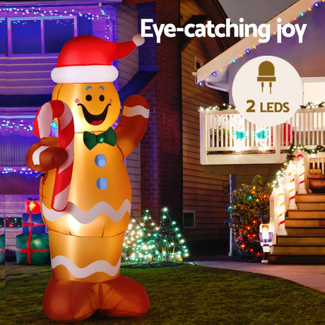 Another view of the inflatable gingerbread man, with pegs and ropes for anchoring.