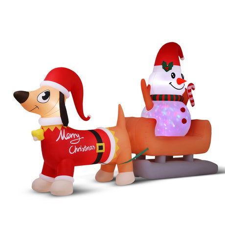 Inflatable snowman and dog decoration 4.2 metres tall, lit by internal LEDs.