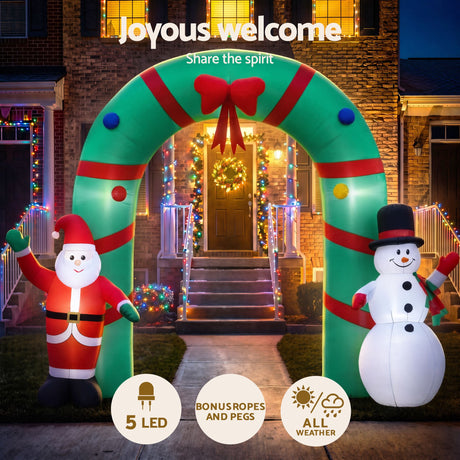 Another view of the inflatable Christmas archway, with pegs and ropes for anchoring.