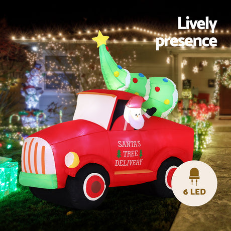 Another view of the inflatable Santa truck, with a built-in air blower.