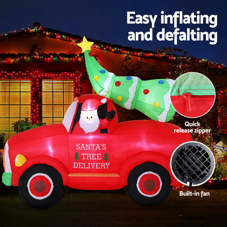 Another view of the inflatable Santa truck, with pegs and ropes for anchoring.