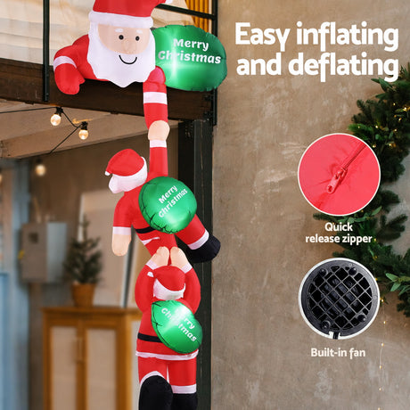 Another view of the inflatable climbing Santa, with pegs and ropes for anchoring.