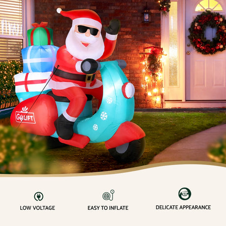 Another view of the inflatable Santa motorbike, with pegs and ropes for anchoring.