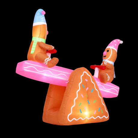 Inflatable Christmas seesaw 1.8 metres tall, lit by internal LEDs.