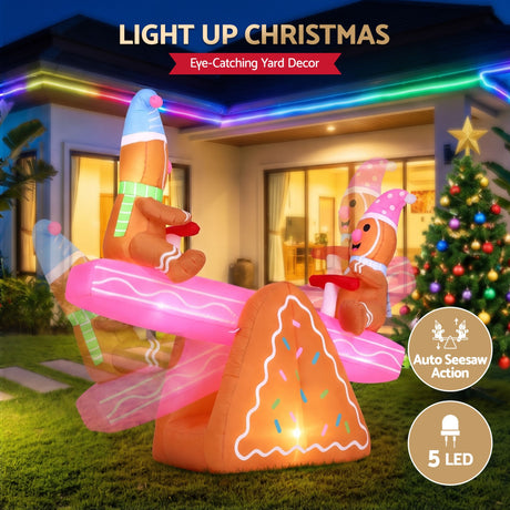 Another view of the inflatable Christmas seesaw, with pegs and ropes for anchoring.