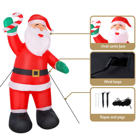 Another view of the inflatable Santa, with pegs and ropes for anchoring.