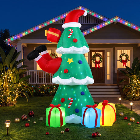 The inflatable Santa and tree shown again, with pegs and ropes for anchoring.