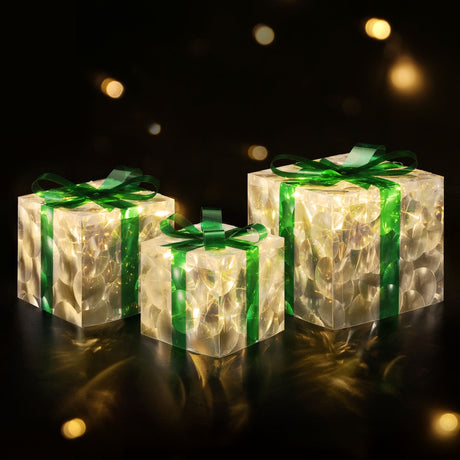 The three lit gift boxes shown again, battery operated.