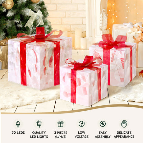 Another view of the three lit gift boxes, with a built-in timer.