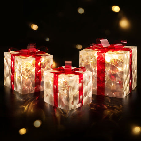 The three lit gift boxes shown again, battery operated.