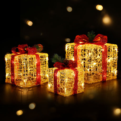 The three lit gift boxes shown again, for indoor or outdoor use.