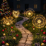 Four solar firework garden lights with warm white LEDs.