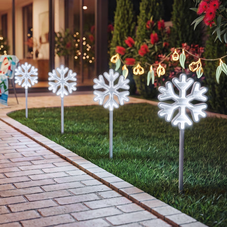 Four Christmas pathway lights for a garden or driveway.