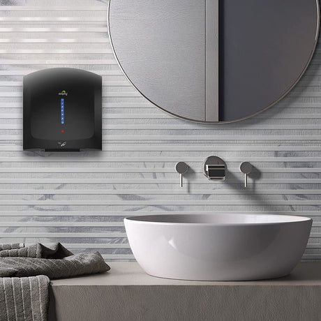 Dolphy black hand dryer mounted on a tiled bathroom wall beside a basin and round mirror
