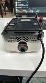 Underside of the Dolphy compact hand dryer showing the infrared sensor and air outlet