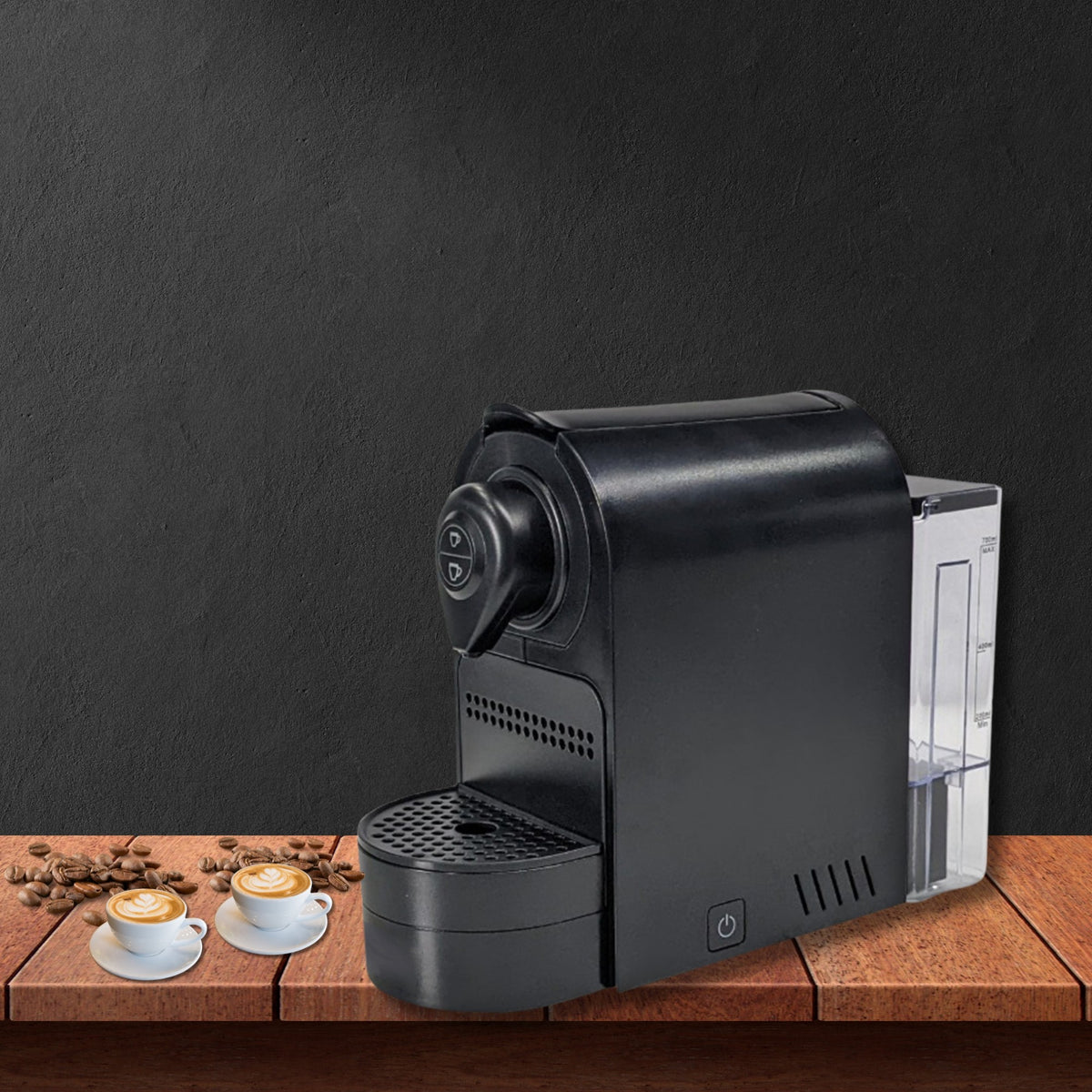 Dolphy black capsule coffee machine on a wooden counter with two cups of coffee