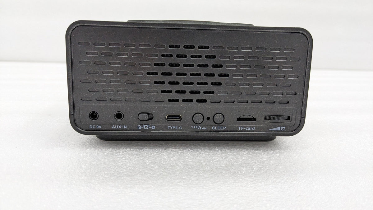 Back of the Dolphy alarm clock dock showing the speaker grille and input ports