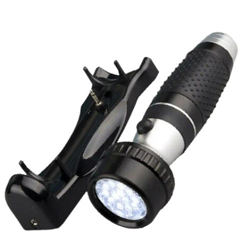 Dolphy LED emergency torch lifted from its wall bracket, showing the bright LED head