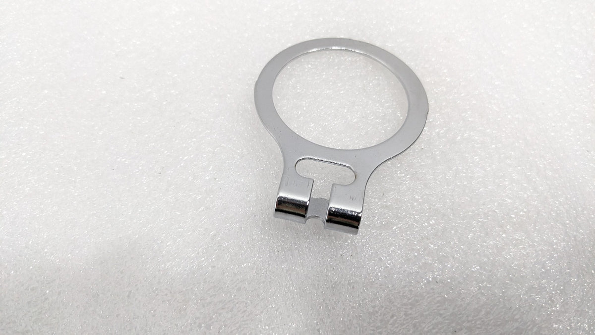 Close-up of the chrome anti-theft ring that stays on the wardrobe rail
