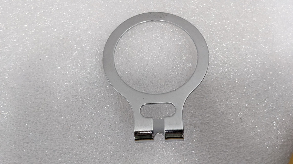 Close-up of the chrome anti-theft ring from a Dolphy security hanger