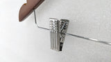Close-up of the chrome trouser clip on the Dolphy wooden security hanger