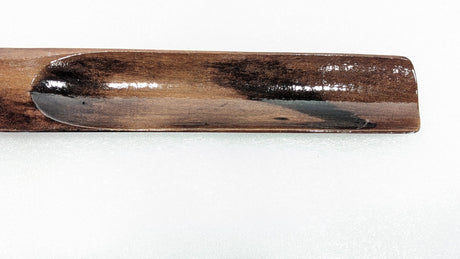 Close-up of the curved heel scoop of the Dolphy wooden shoe horn