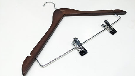 Dolphy brown wooden hanger at an angle, showing the shoulder notches and clip bar