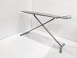 Dolphy grey folding ironing board standing open, side view of the steel X-frame legs
