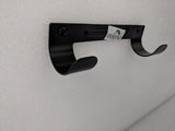 Dolphy black ironing board holder side angle showing the curved hooks