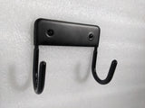 Dolphy black ironing board hanger at an angle, showing the two curved hooks