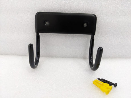Dolphy black wall-mounted ironing board hanger with its screws and wall plugs