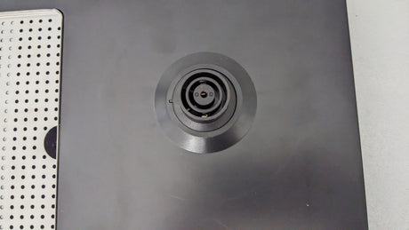 Close-up of the built-in kettle power base on the Dolphy black ABS tray