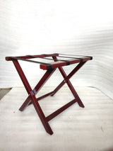 Dolphy cherry red wooden folding luggage rack open, angled view with black straps