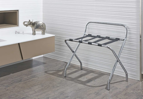 Dolphy stainless steel luggage rack with black straps standing in a modern bathroom