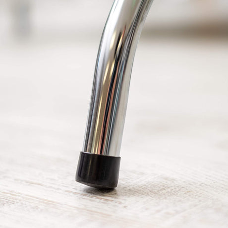 Close-up of a rubber foot cap on the Dolphy luggage rack leg, protecting the floor
