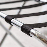 Close-up of the black nylon webbing straps looped over the Dolphy luggage rack's chrome frame