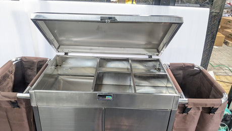 Dolphy housekeeping trolley with the top lid open, showing the storage compartments