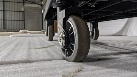 Close-up of a swivel castor wheel on the Dolphy housekeeping cart